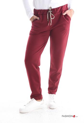 Trousers with belt with pockets